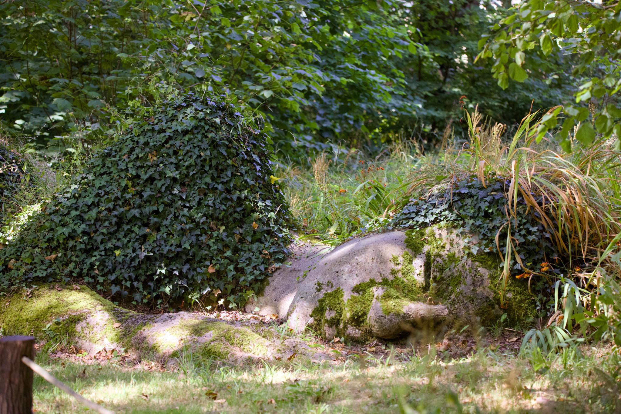 The Mud Maid, a sleeping figure overgrown with ivy and moss
