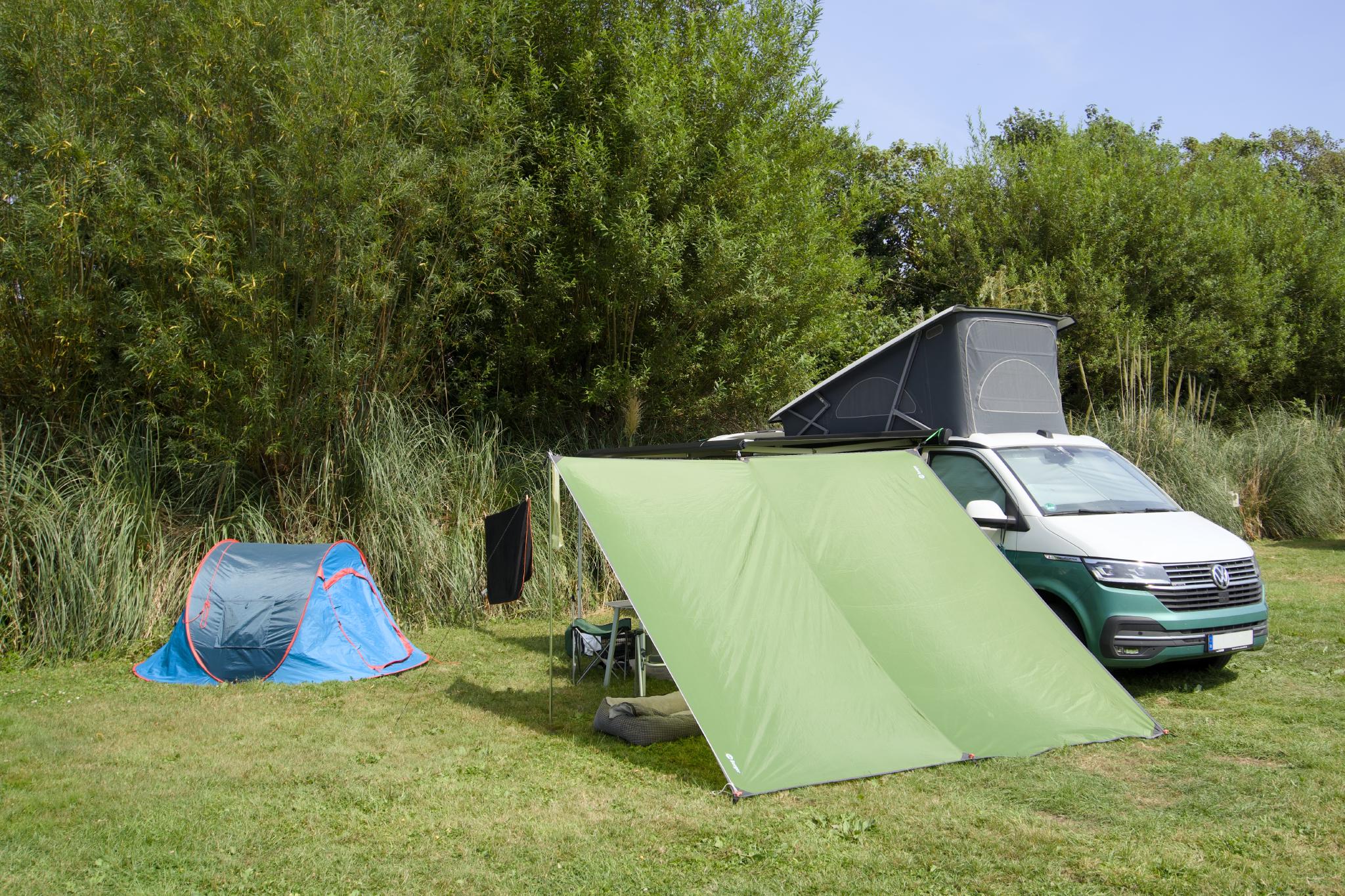 The California with the green awning tent and the blue pop-up tent on the pitch
