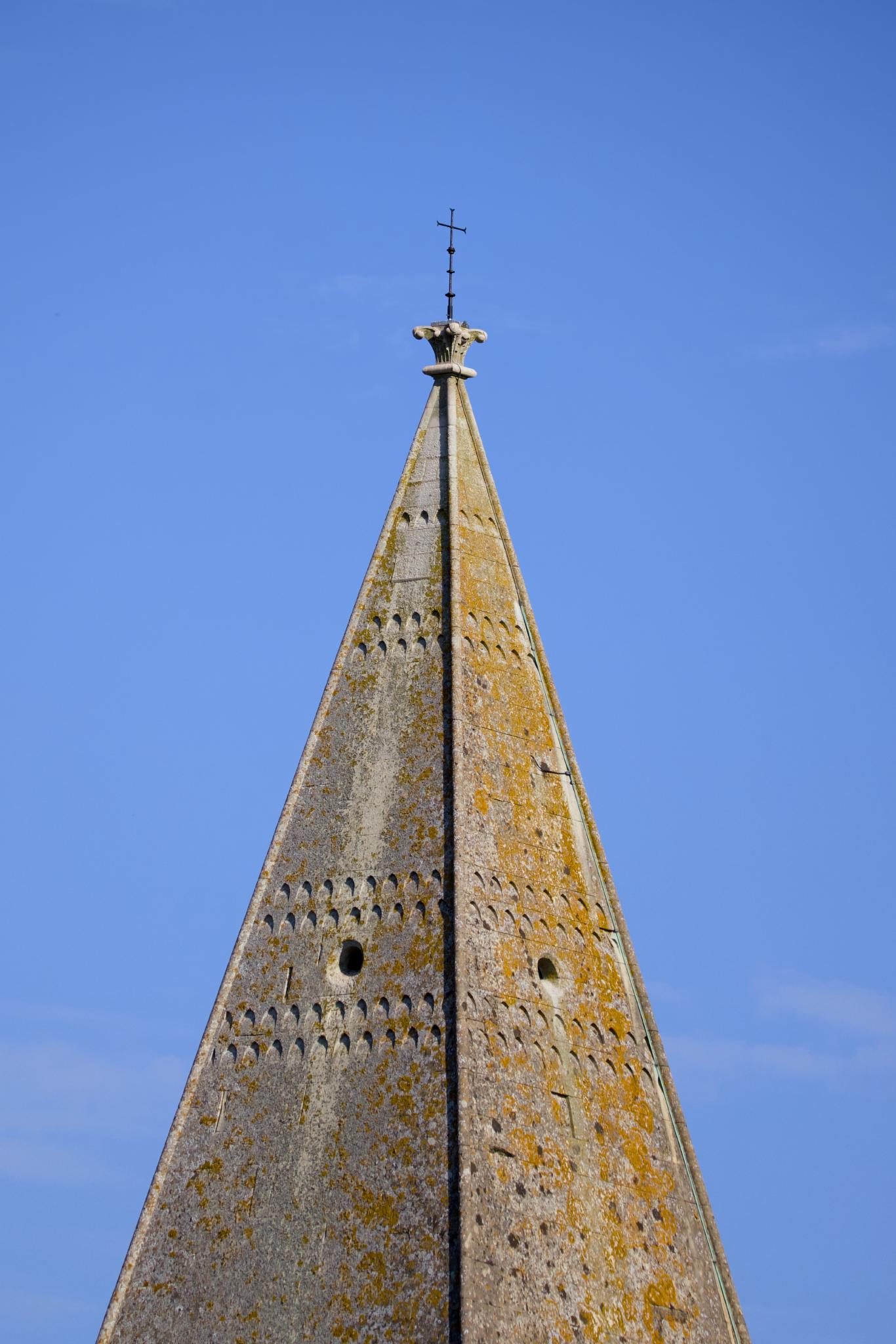 Spire of St John the Baptist against a blue sky