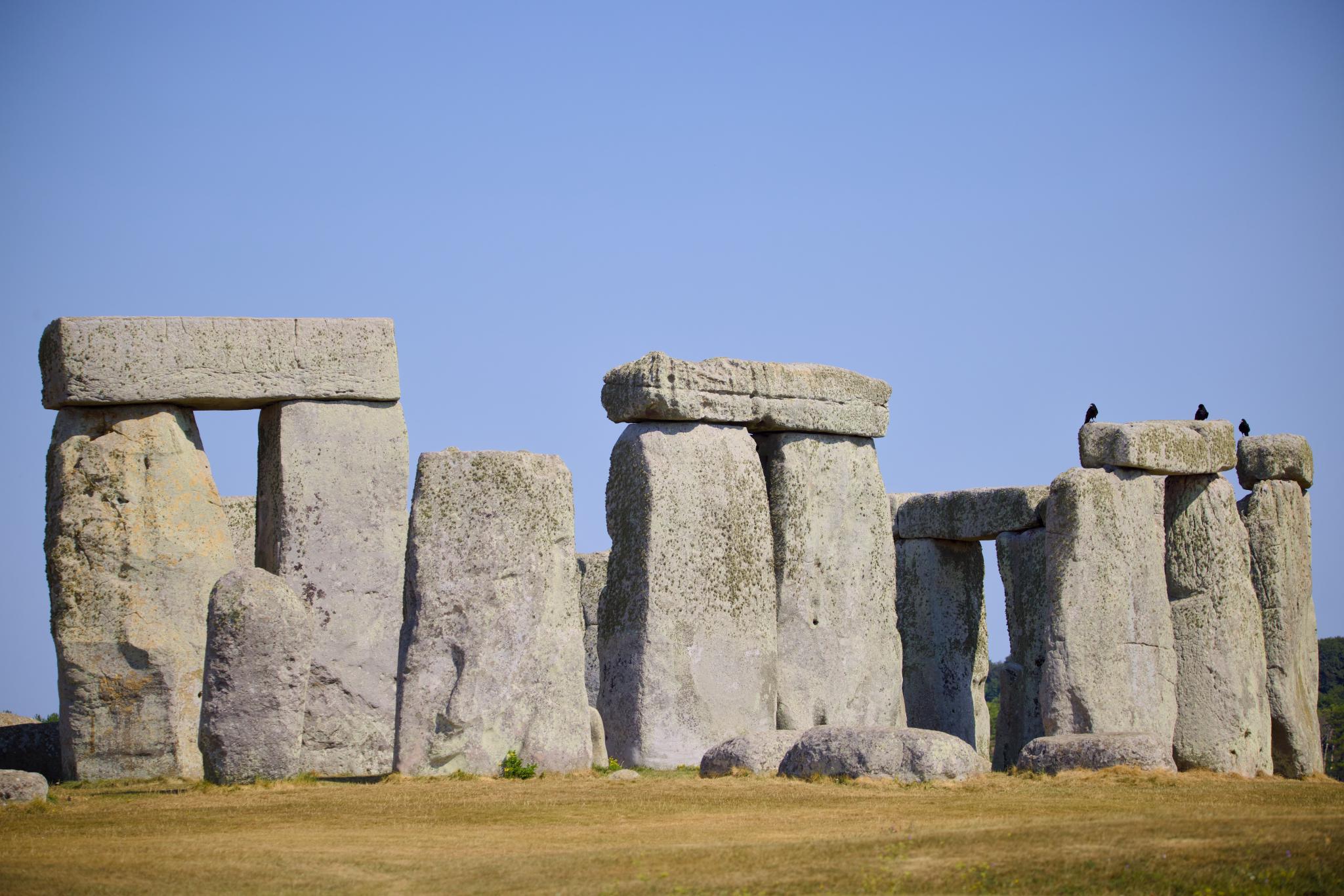 Stonehenge with birds perched on a lintel