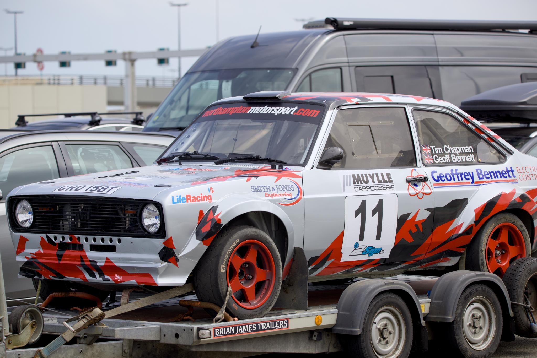 Classic Ford Escort rally car on a trailer in the ferry queue