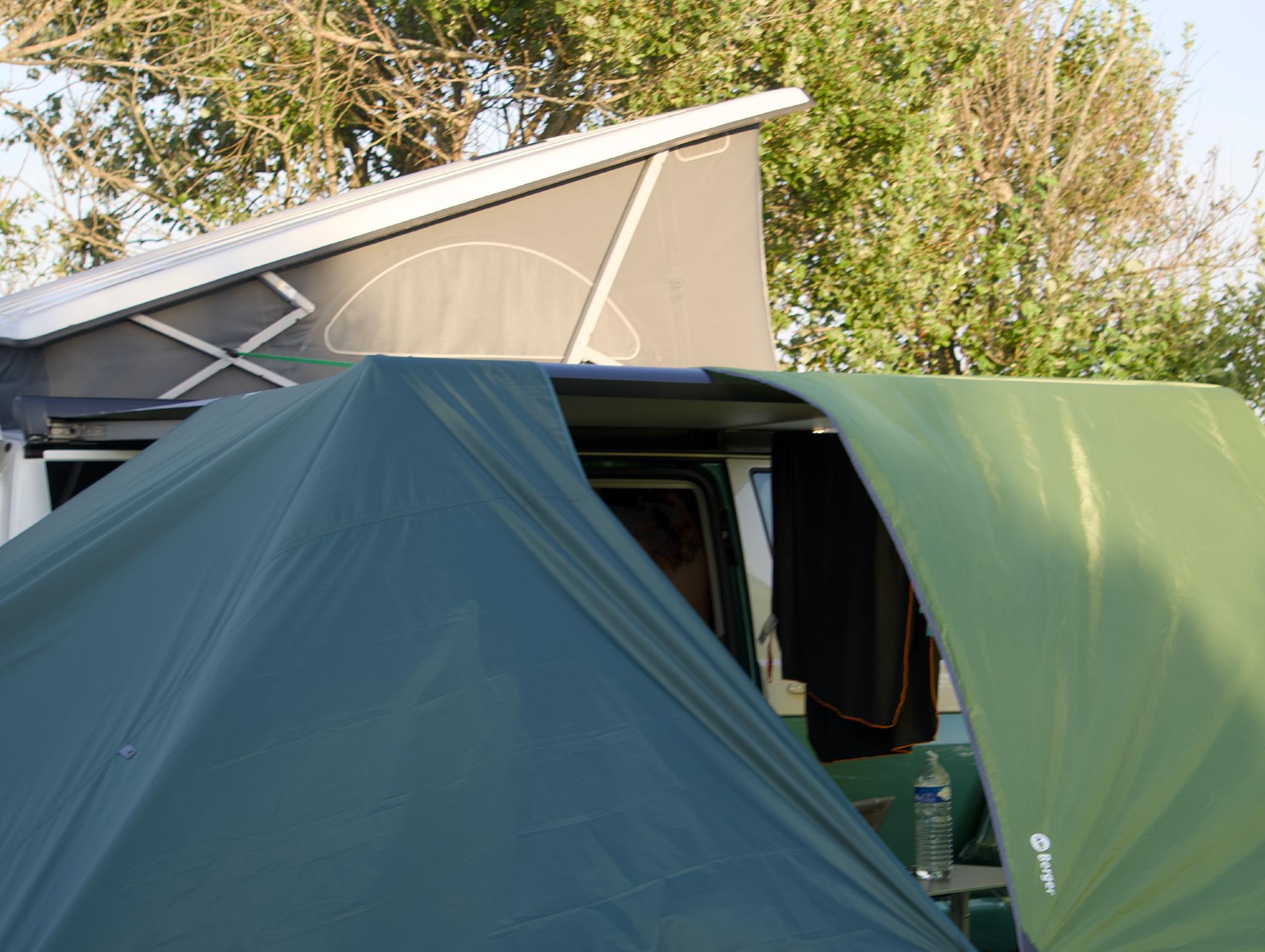 California with the roof up and the pop-up tent in front, evening light