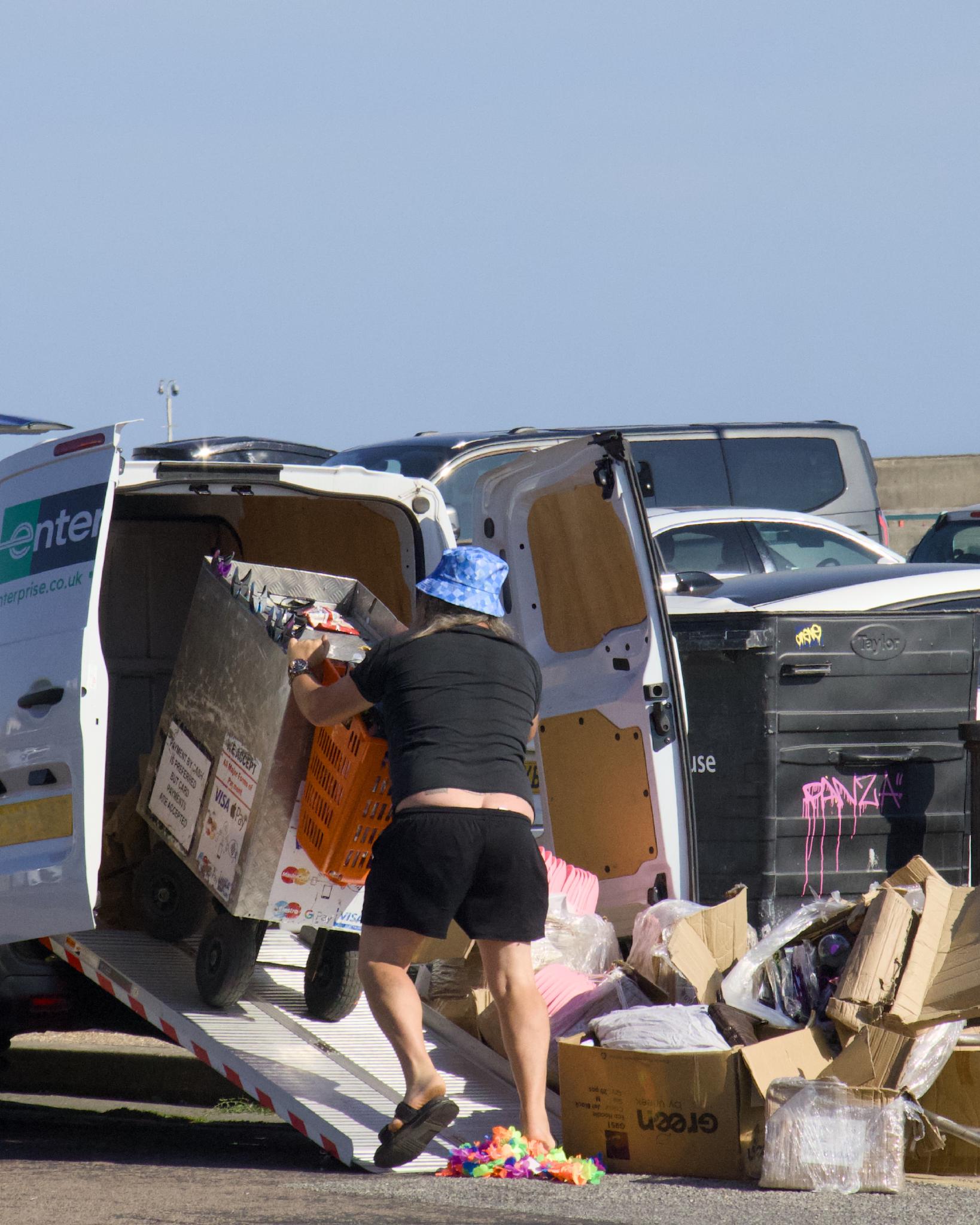 Street vendor loading his cart into a rental van