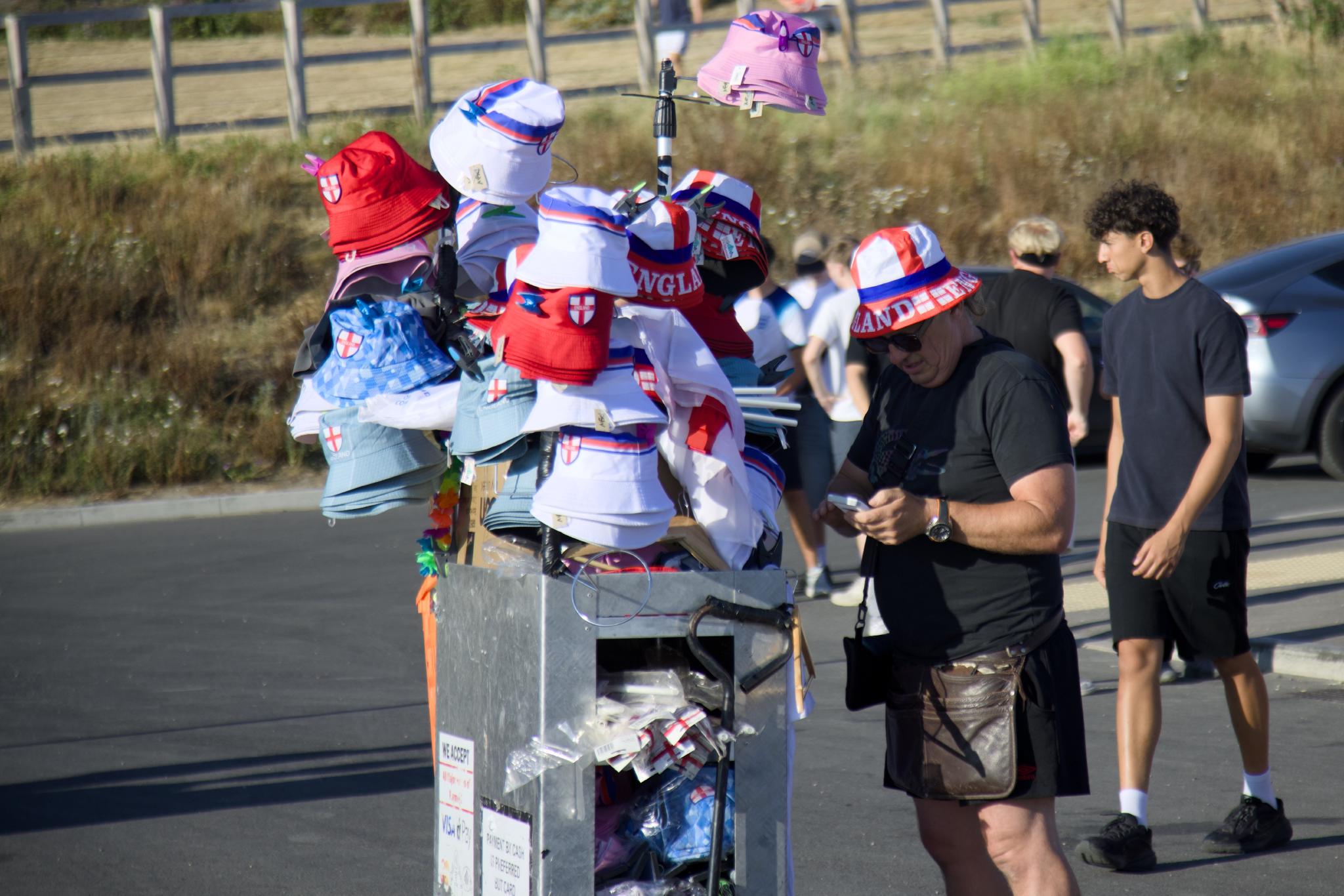 England bucket hats on a vendor cart