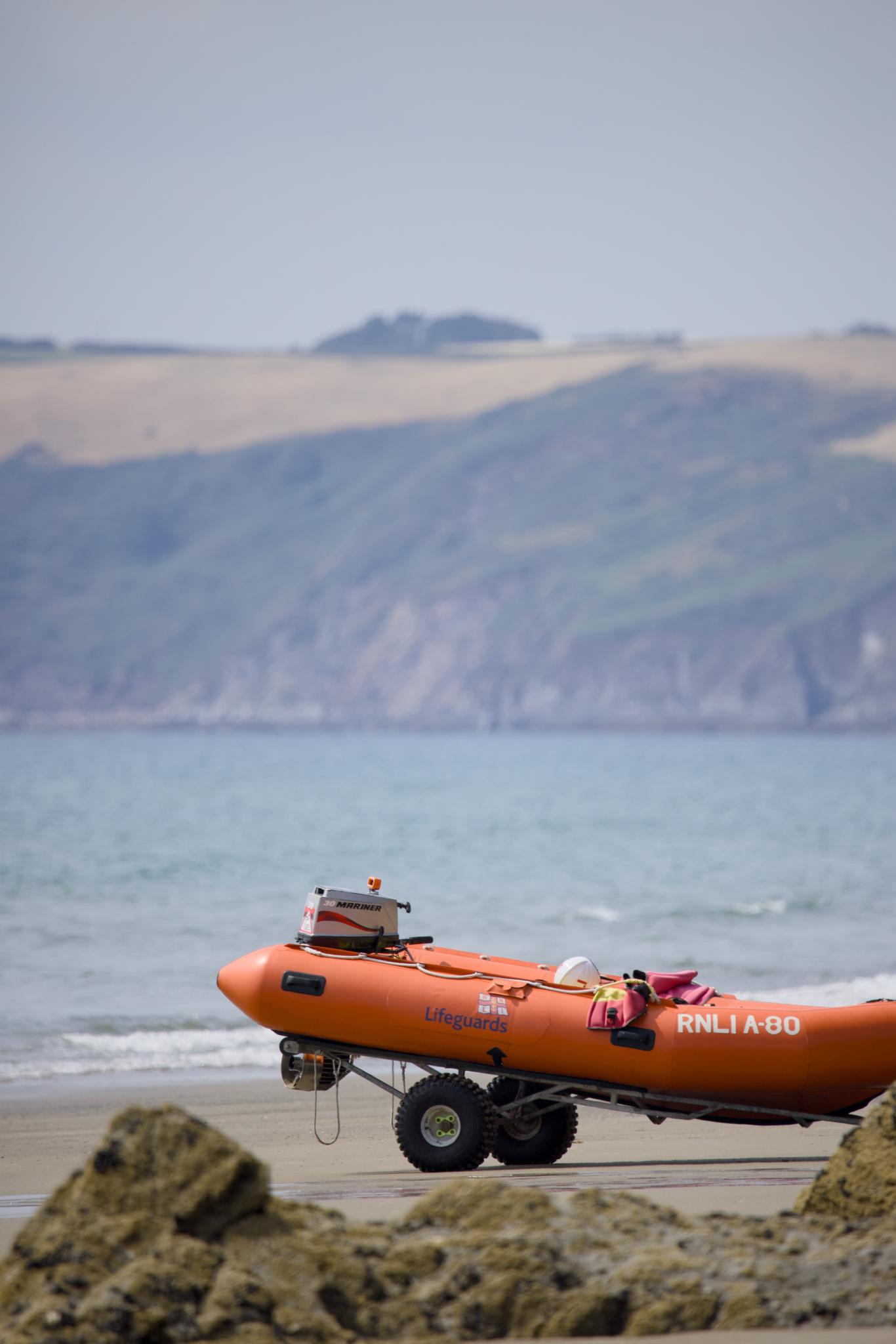 RNLI lifeguard boat on a trailer on the beach
