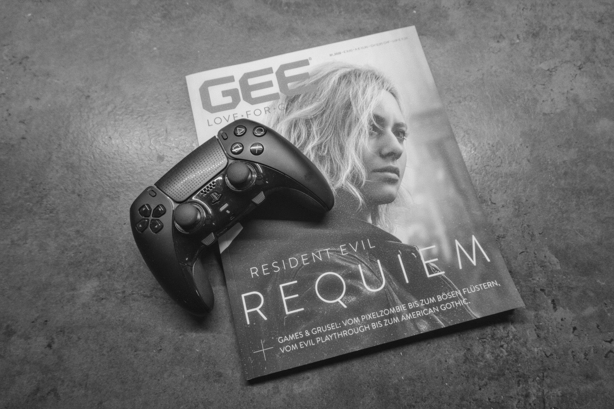 PS5 controller resting on a GEE magazine with Resident Evil Requiem on the cover